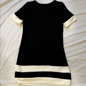 Simple symmetrical black dress